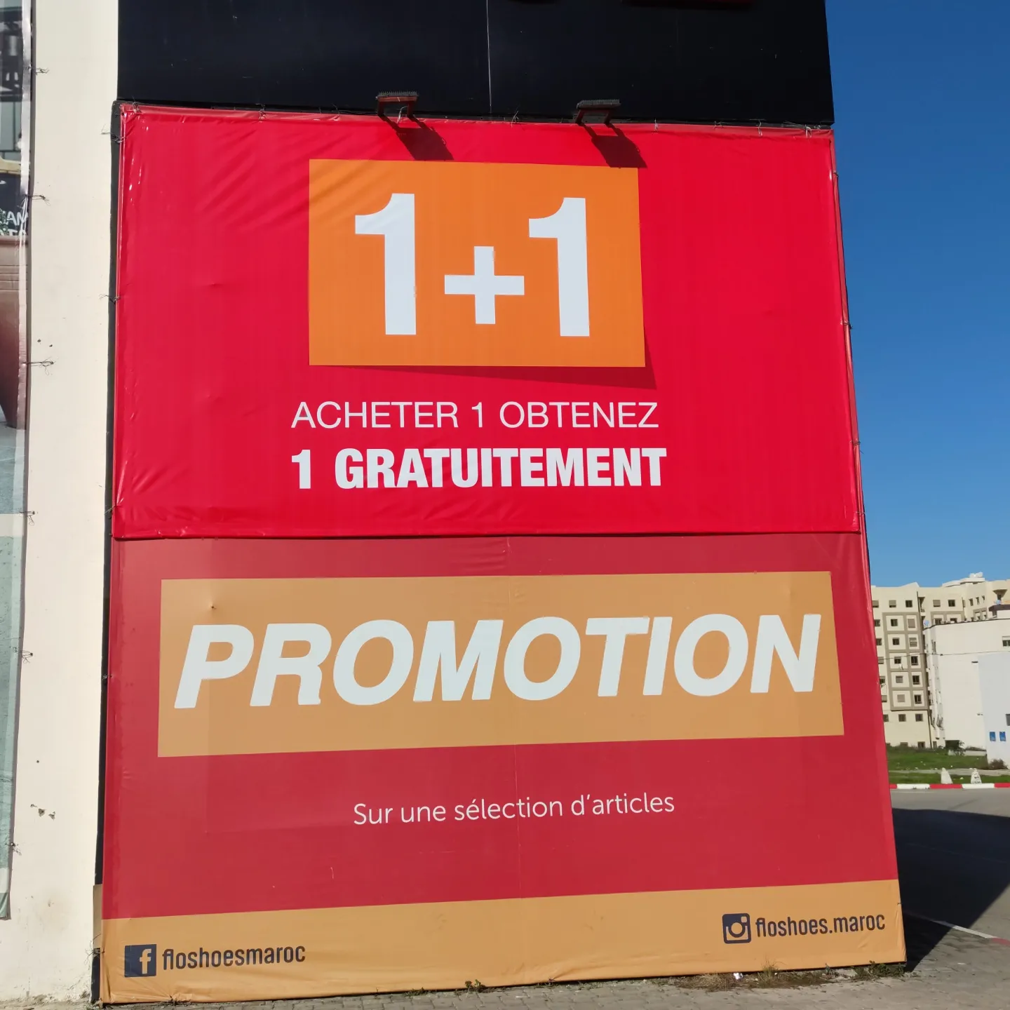 Campagne FLO — promotion — Bâche grand format tendue sur façade